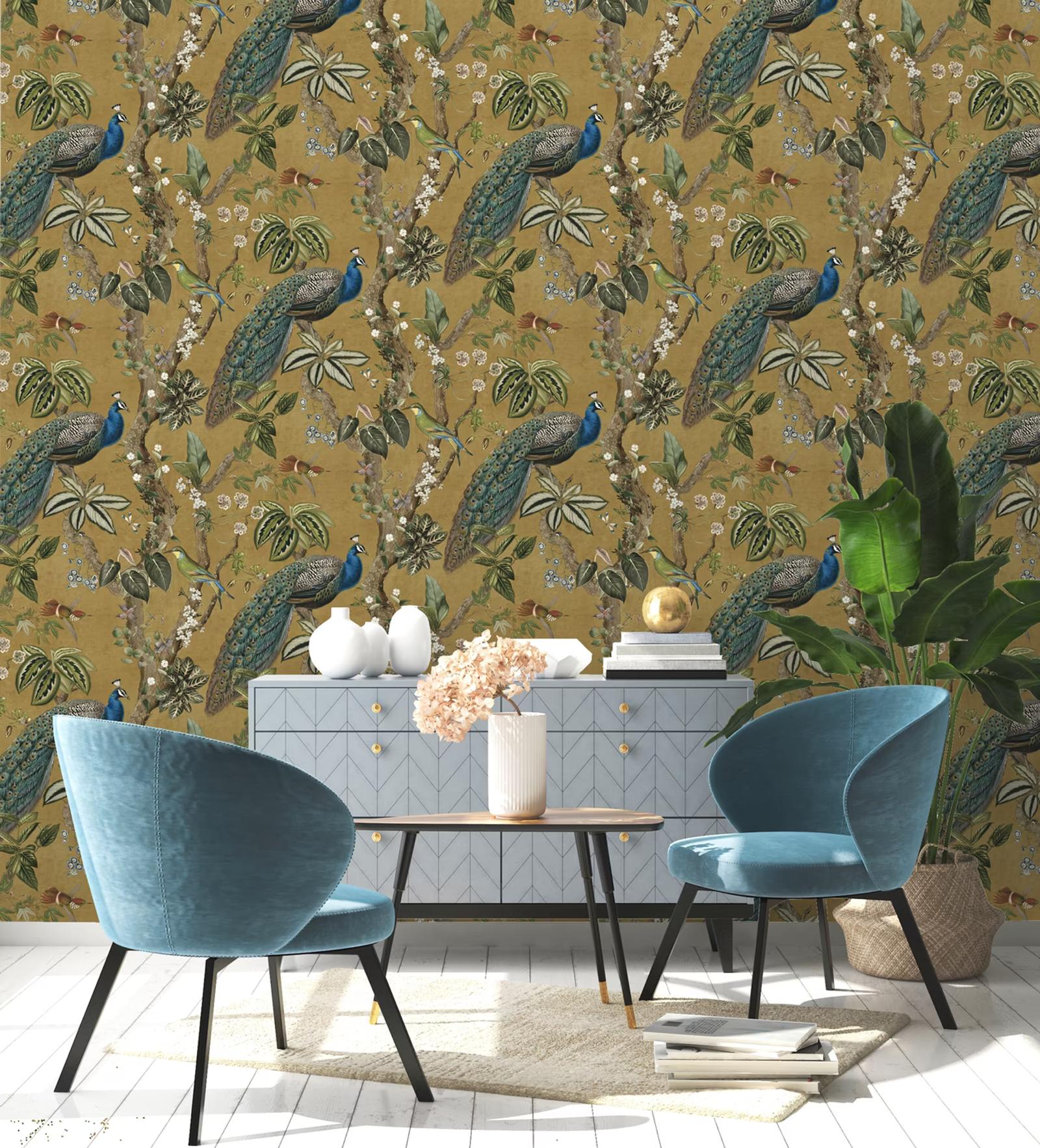 Cassia Ochre peacock wallpaper in a dining room with blue velvet chairs