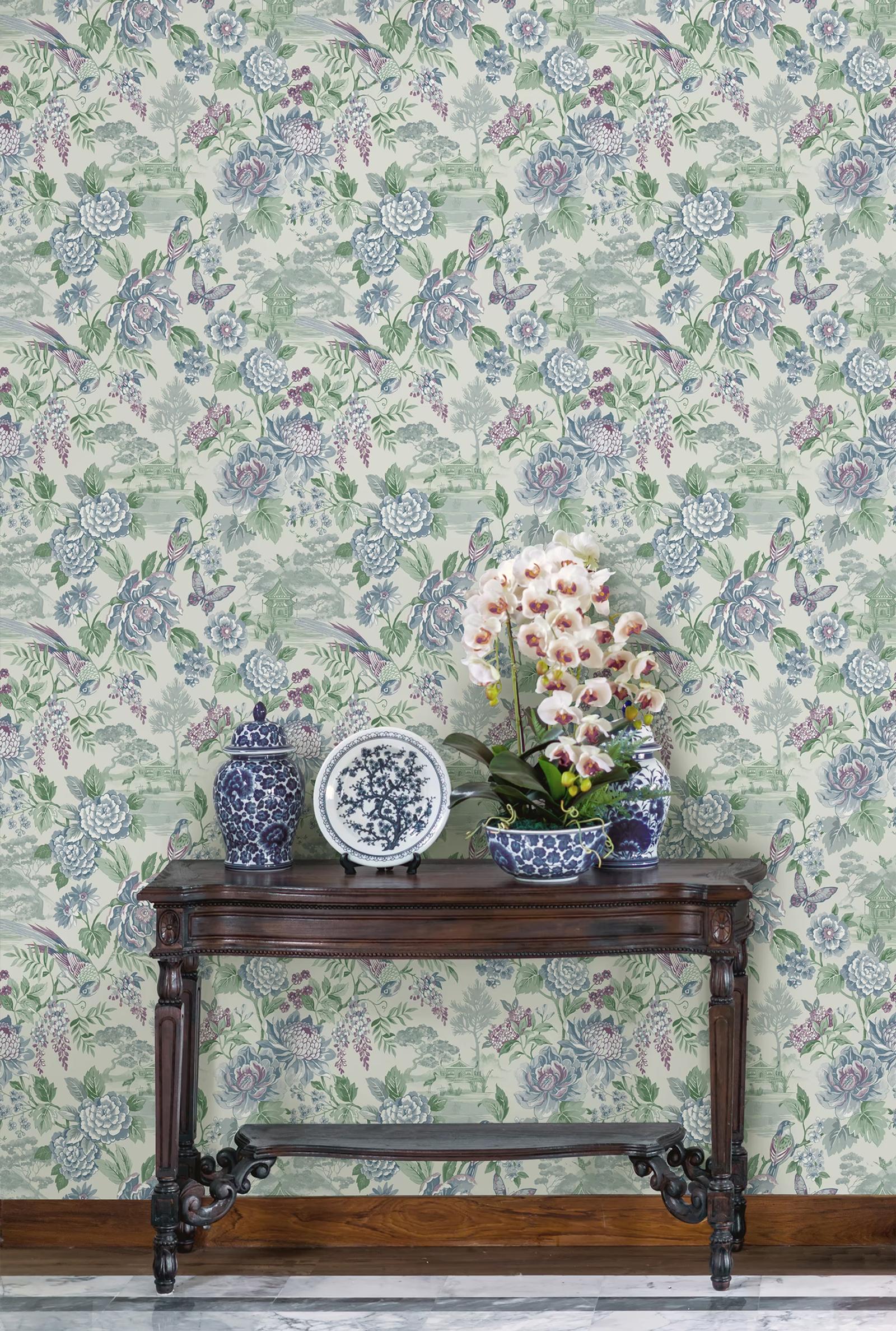 Hana Blue floral wallpaper behind a console table