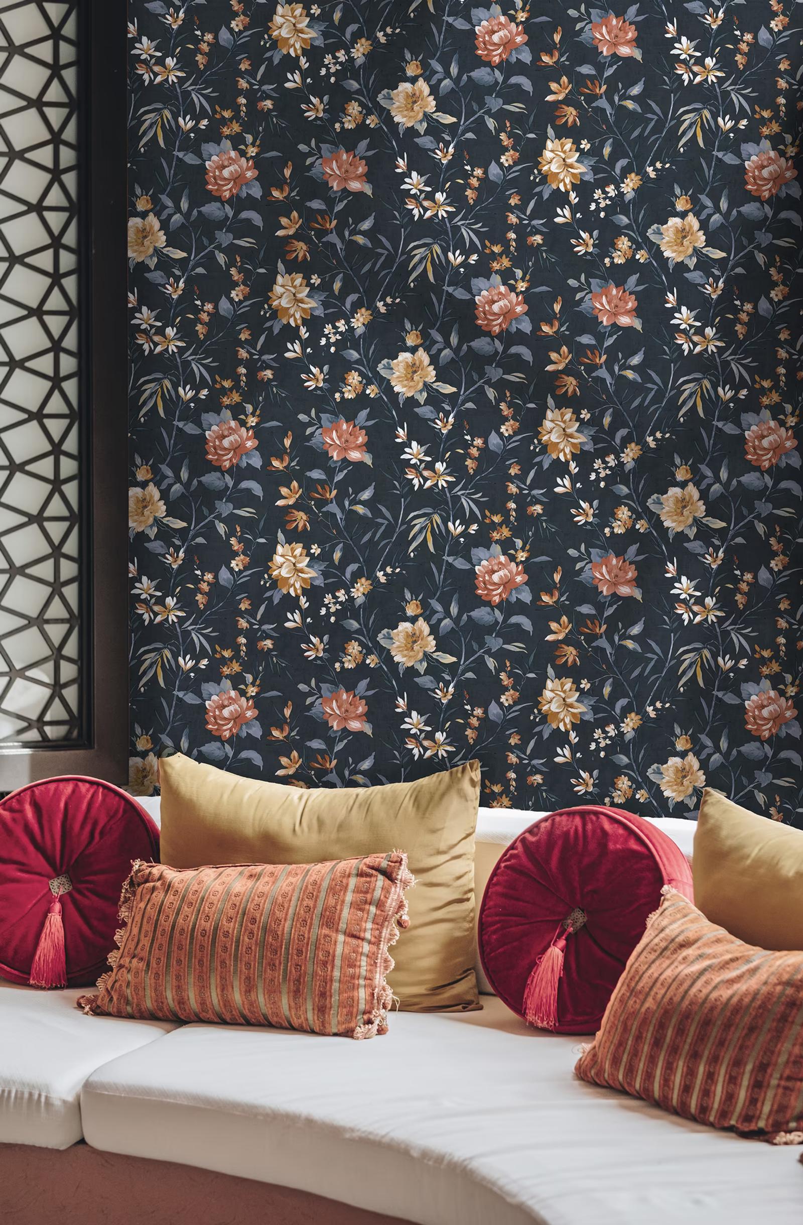 Sazanka Navy floral wallpaper behind velvet cushions