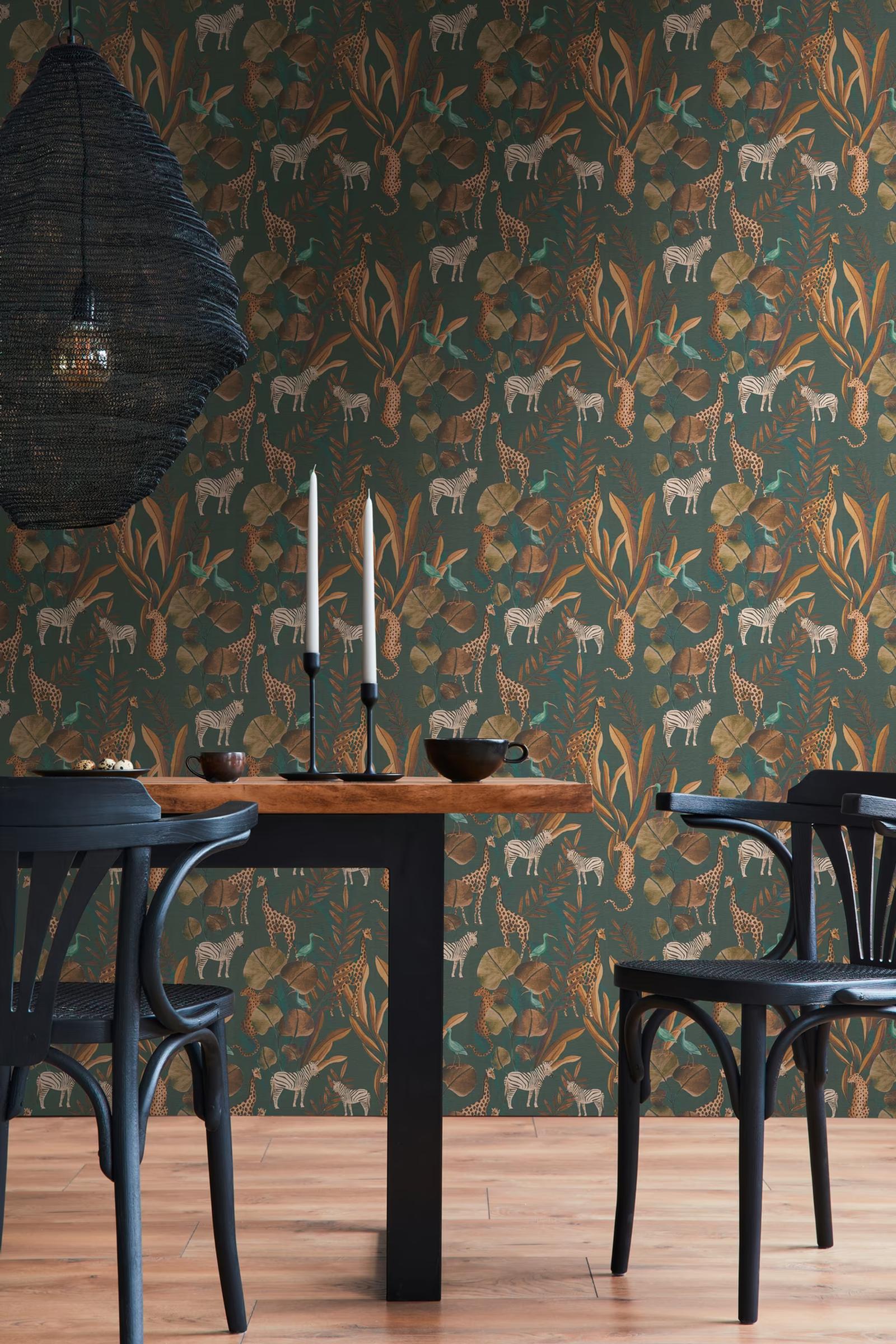 Teal Safari wallpaper in a dining room with a rattan pendant