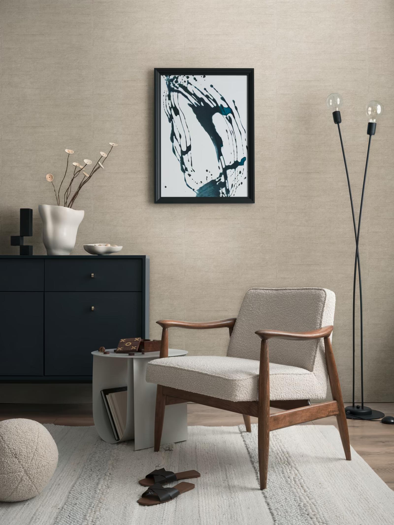 Pewter Silk wallpaper in a living room with a navy cabinet and framed print