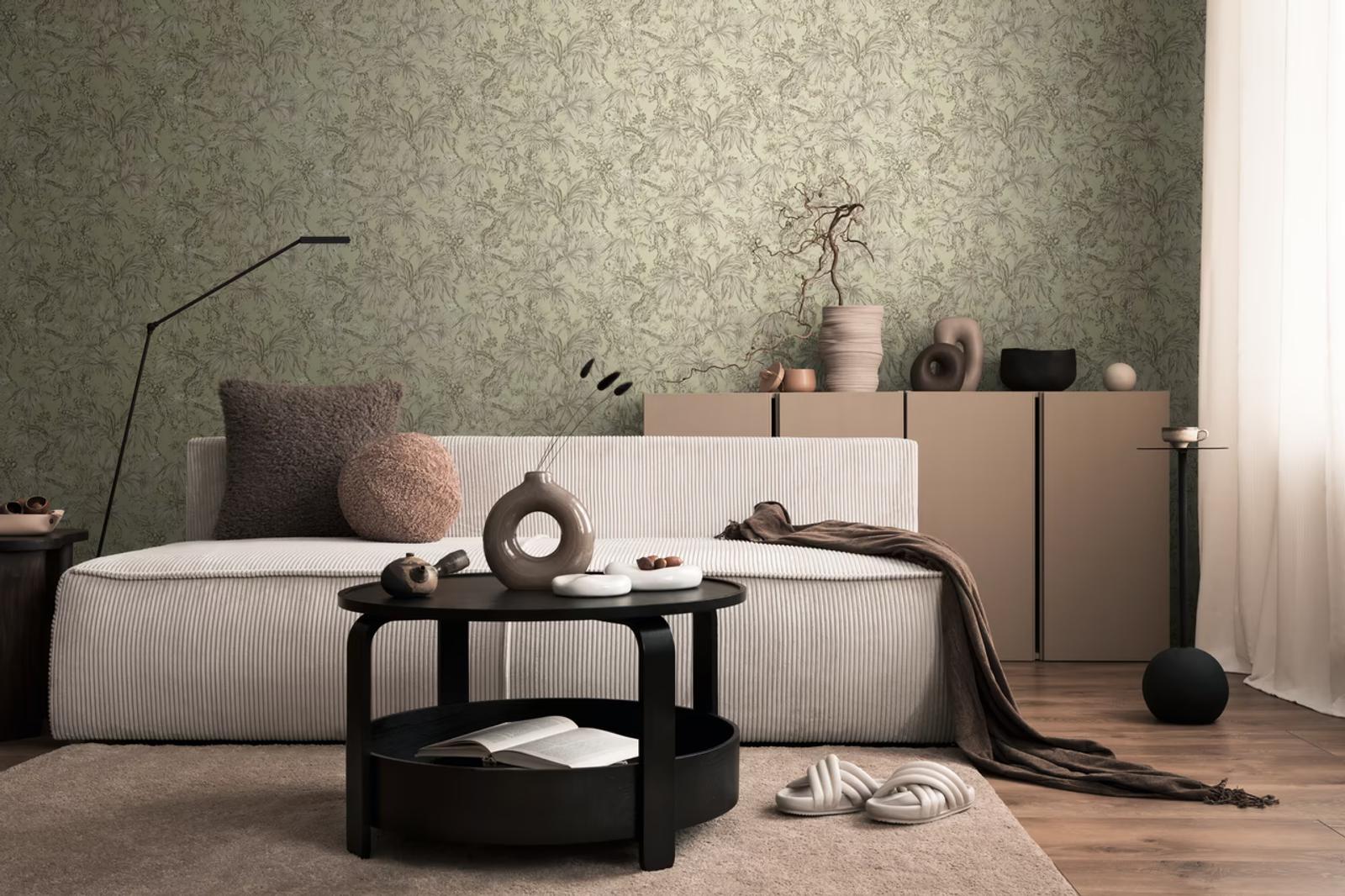 Sage Botanica wallpaper behind a corduroy sofa and black coffee table