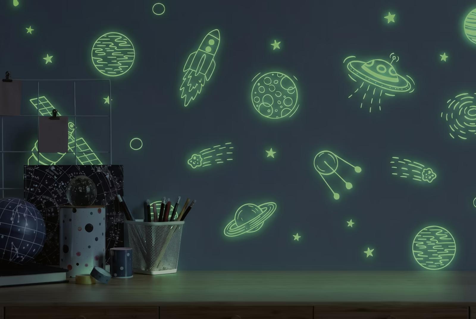 Blue Cosmos wallpaper glowing in the dark above a child's desk