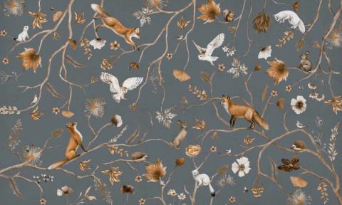 Foxes, owls and little birds scattered among fine branches and wildflowers in a light, hand-drawn all-over design. Shown on a soft blue ground. Even and delicate across the wall, it dresses a room without crowding it.