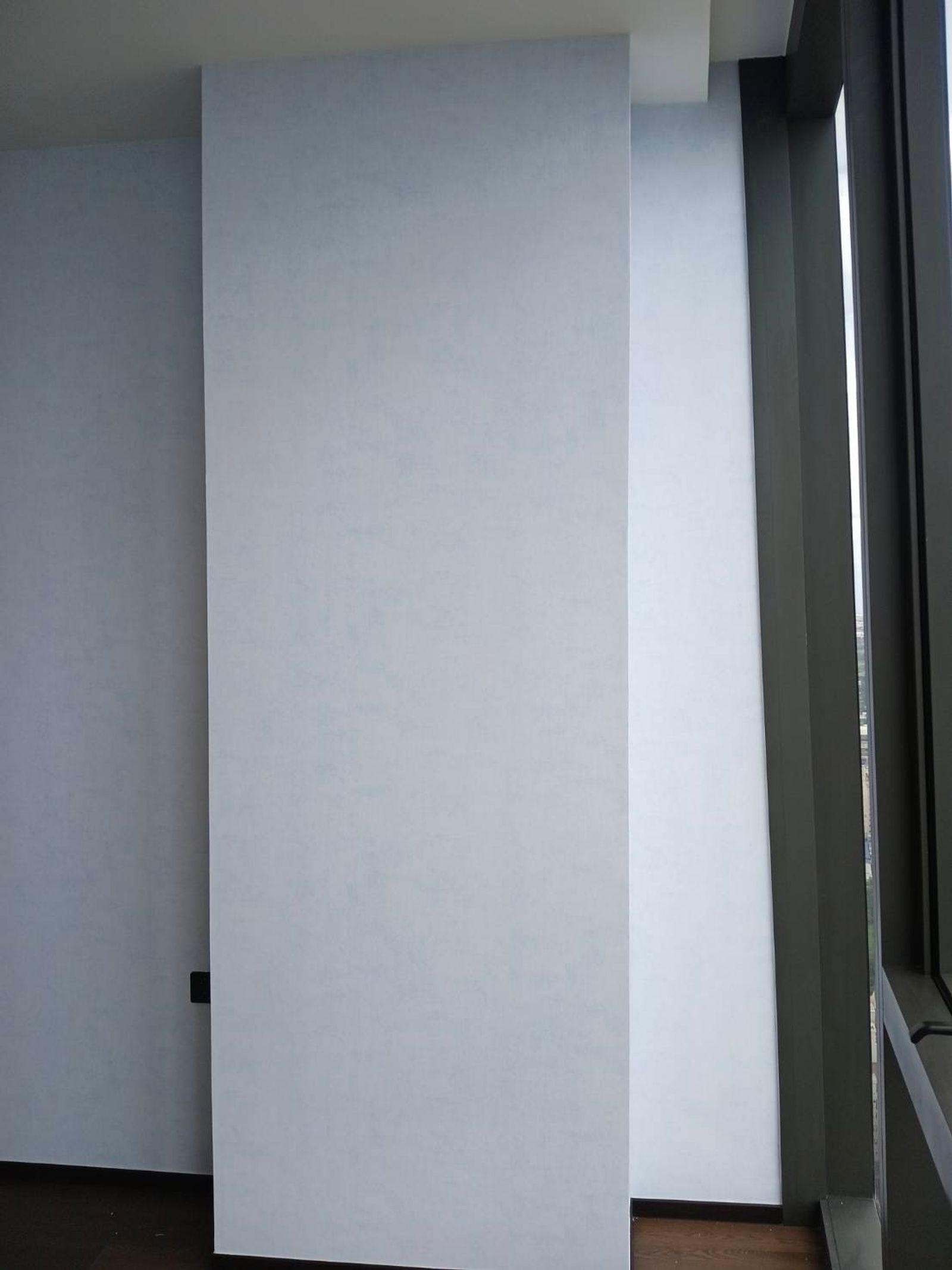 Sky Wash wallpaper carried around the window return, the pale watercolour texture reading differently in direct daylight
