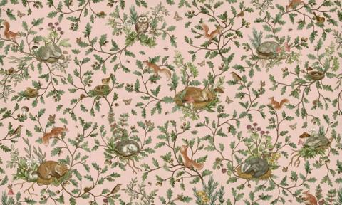 Woodland animals — rabbits, foxes and birds — dotted through leaves and berries in a fine all-over pattern. Shown on a dusky pink ground. Warm and storybook, it is a wall a child grows into.