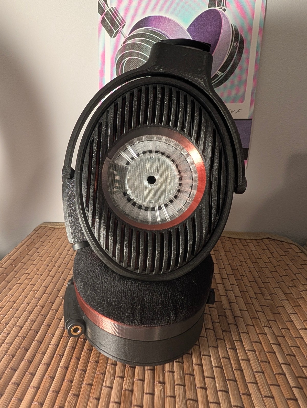 Black Satyr 4 with a copper ring around the driver, standing on its pads