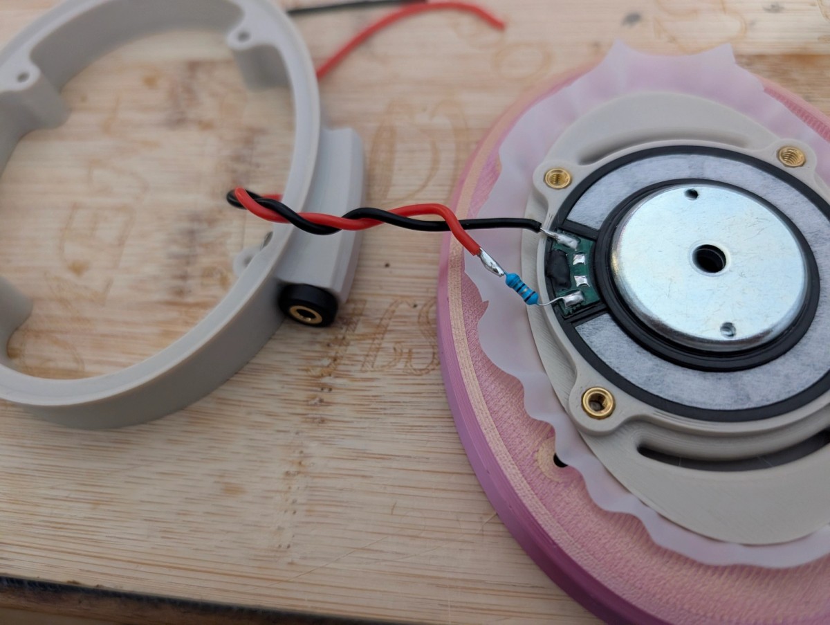 Satyr 4 build in progress: a driver wired into an ivory baffle, cup parts around it