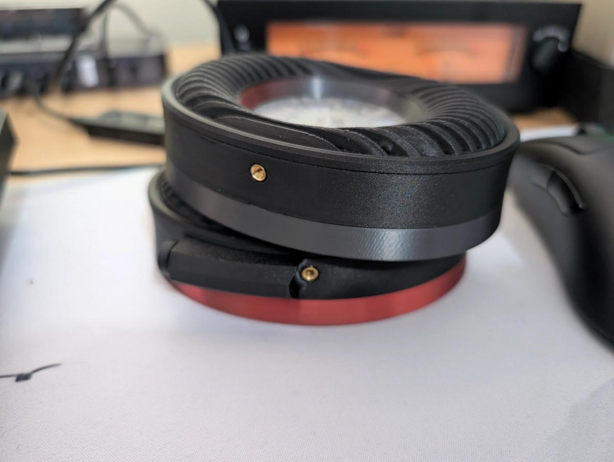 Black Satyr 4 cups with rose-red rings, stacked on a desk