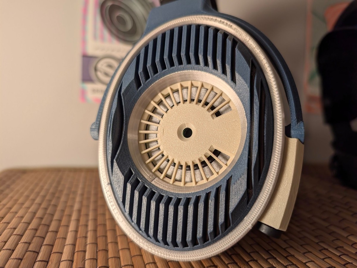 Satyr 4 printed in blue and ivory, front view of the open-back grille
