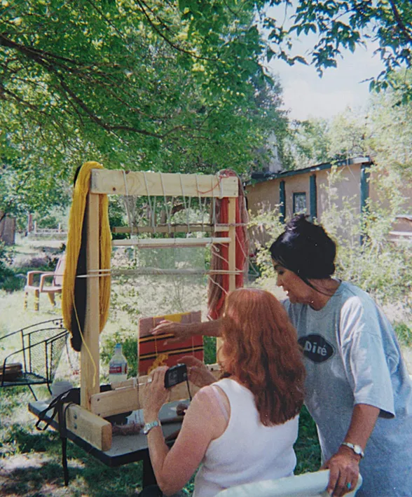 Perl teaching a student Navajo weaving