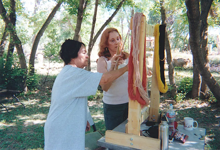 Perl teaching a student Navajo weaving