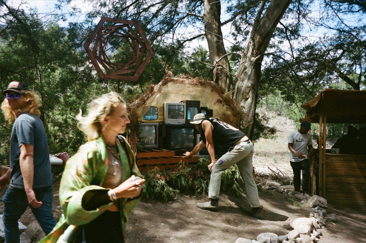 CRT television stack installed in an earthen dome at an outdoor festival