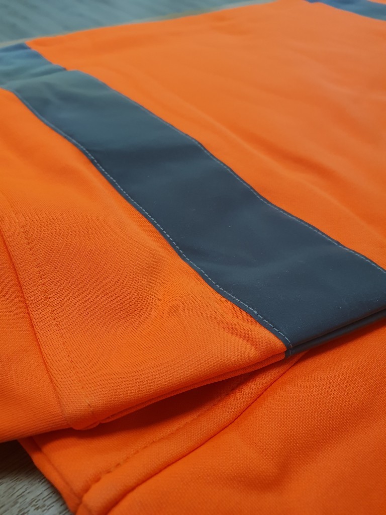 Close-up of retroreflective tape applied to a hi-vis garment