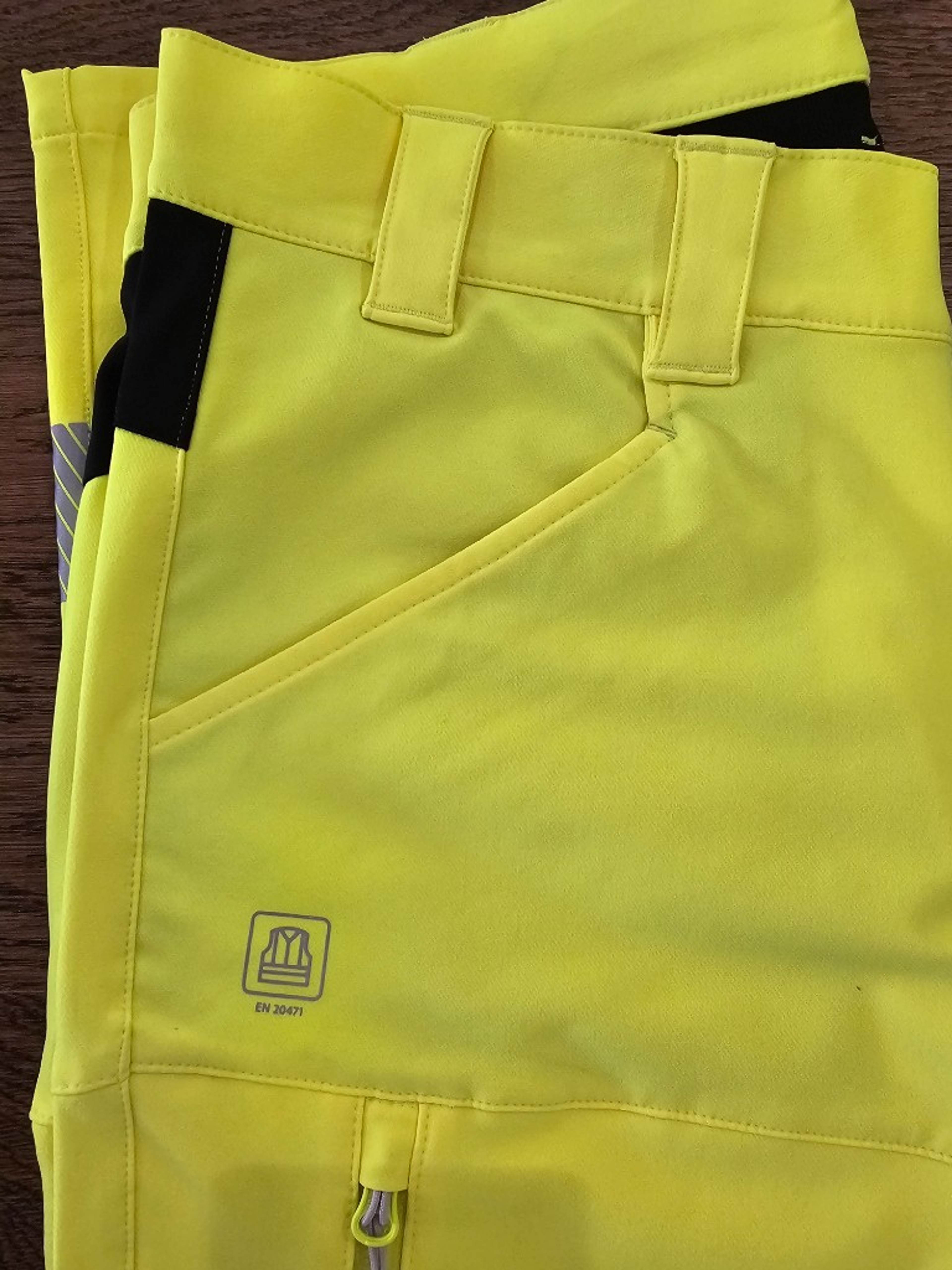 Hi-vis cargo trousers with EN ISO 20471 reflective tape and compliance marking