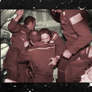 astronauts hug in space