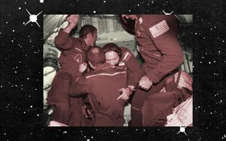 astronauts hug in space