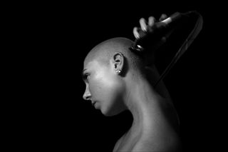 why would a woman shave her head