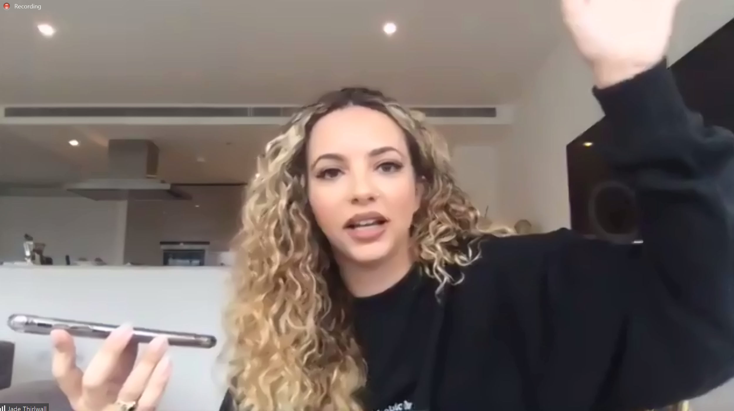 Jade Thirlwell of Little Mix recording a podcast whilst waiting for her sausages to cook