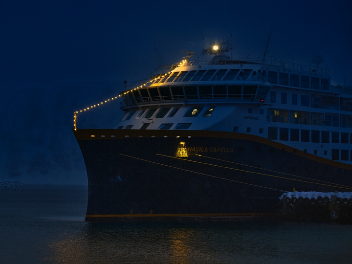 Havila ship in the night with lights in front