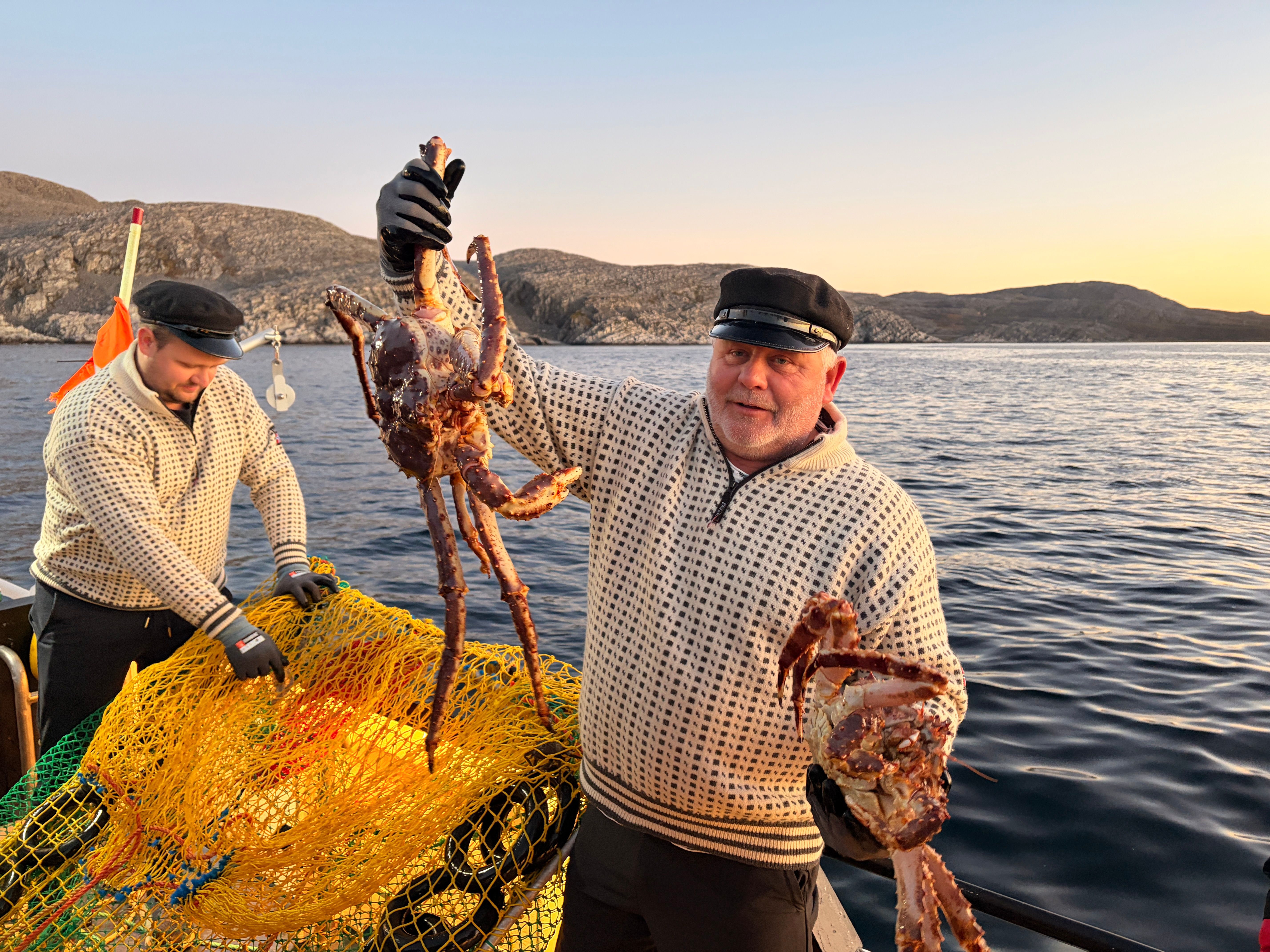 Captain holding up the crab