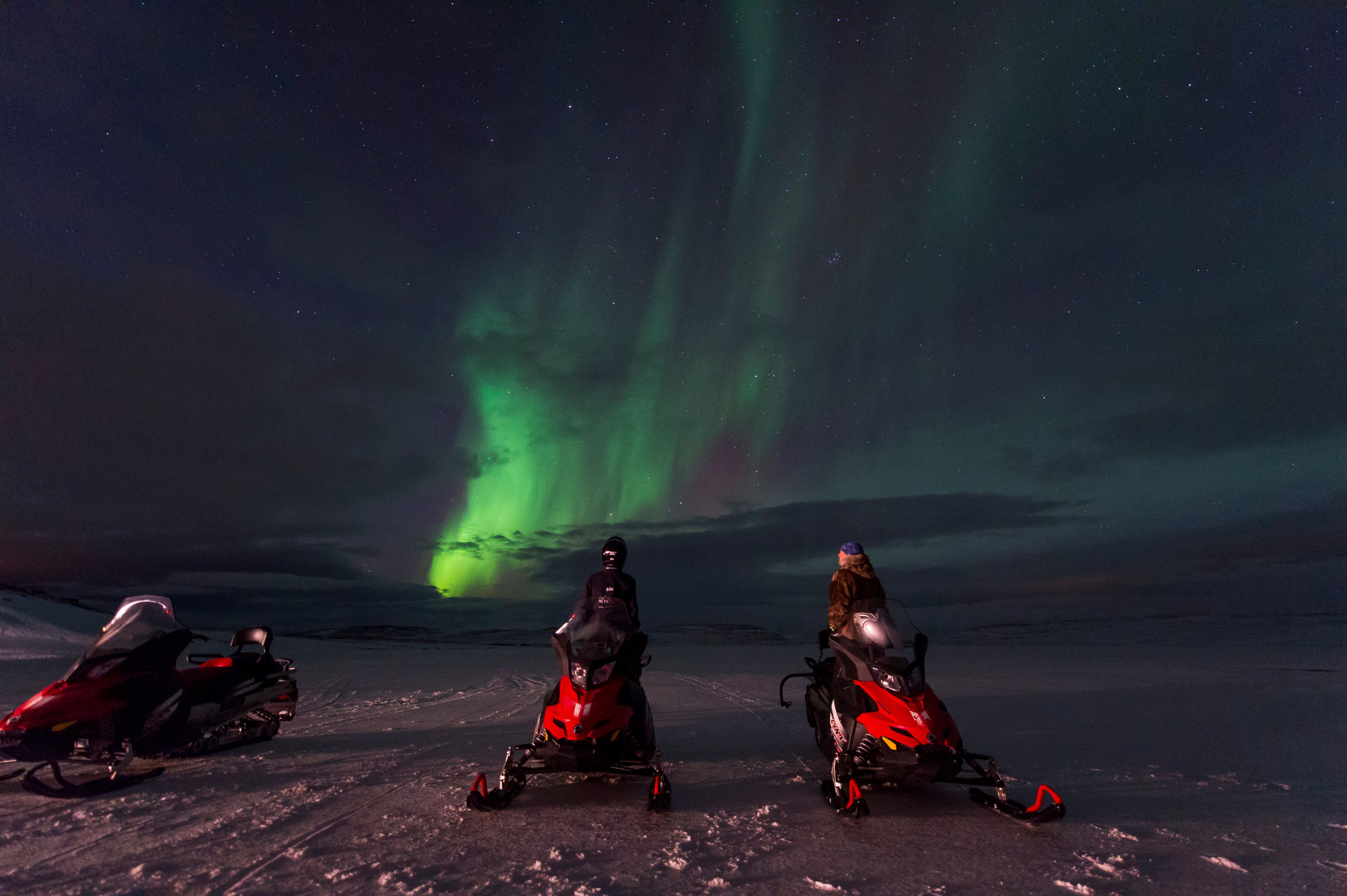 Snowmobile safari beneath the Northern Lights