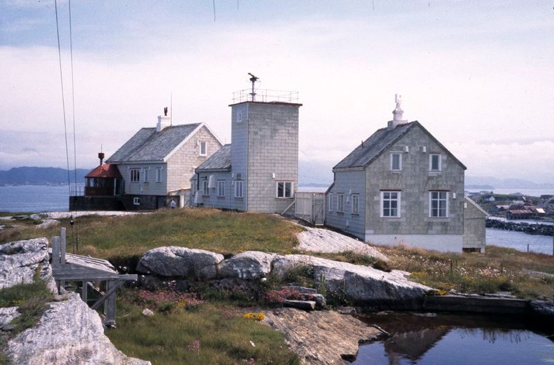 Bjørnsund Lighthouse overlooking the rocky islands and crystal-clear waters of Norway's scenic western coastline