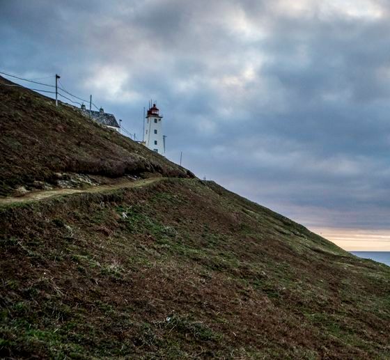 Vardø Lighthouse in Finnmark, Norway, overlooking the Barents Sea with rugged Arctic coastline and dramatic northern landscapes