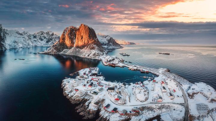 Stay in a hotel surrounded by Lofoten's dramatic mountains, white-sand beaches, and charming fishing villages.