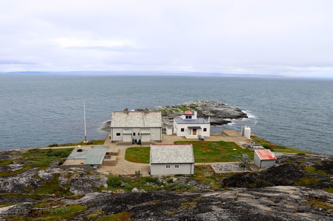 Bøkfjord Lighthouse in Sør-Varanger, Finnmark, Norway, overlooking the Barents Sea and the rugged Arctic coastline