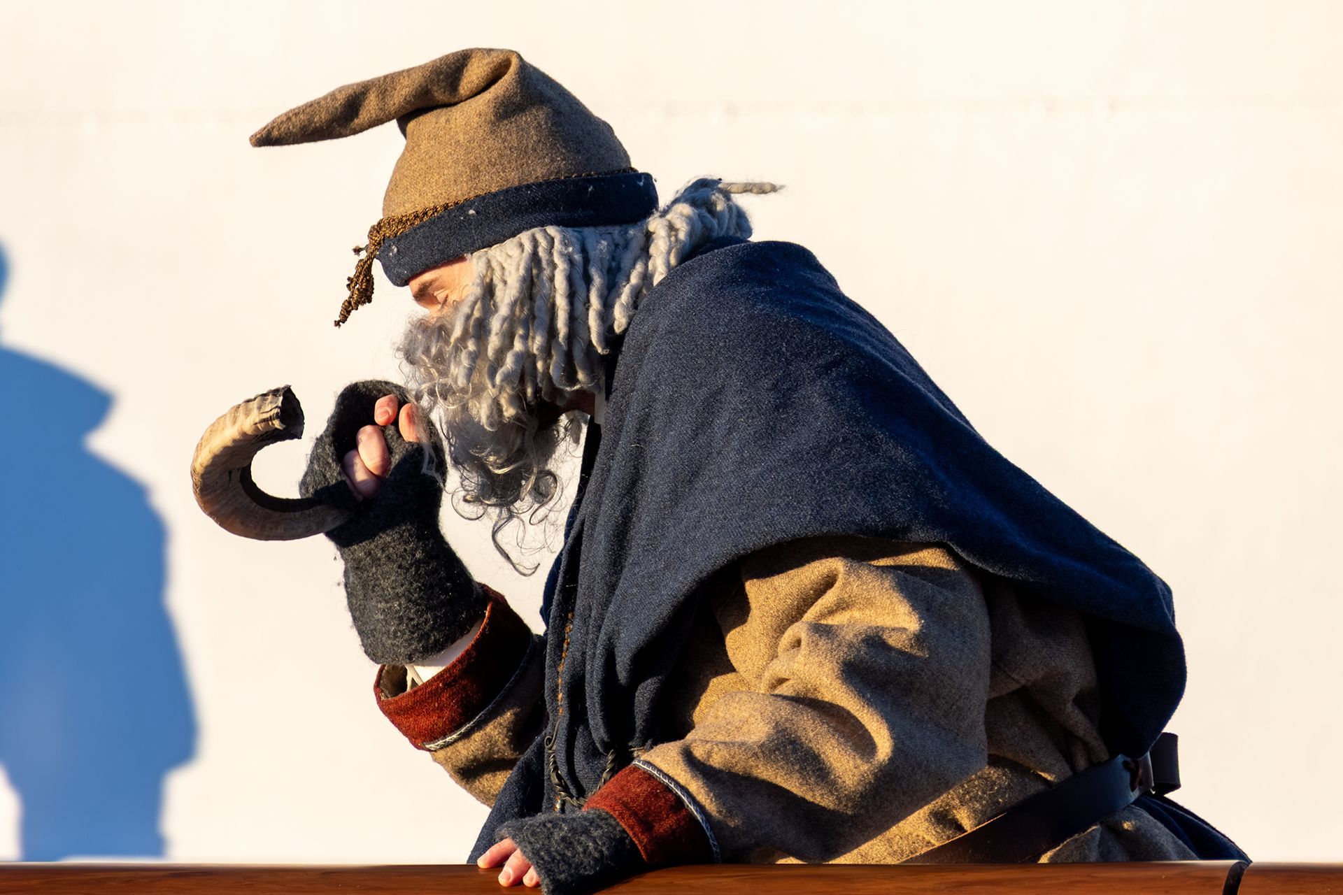 Njord costume with grey beard and drinking horn at the Arctic Circle crossing ceremony
