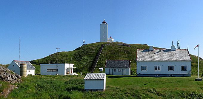 Fruholmen Lighthouse on Norway's northernmost coast, overlooking the Barents Sea with rugged Arctic rocks and dramatic coastal scenery