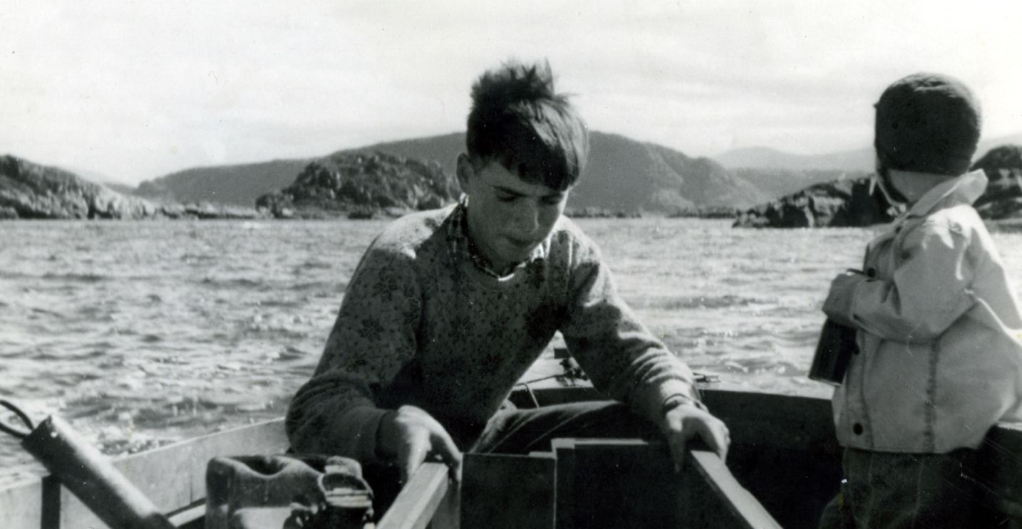 Young Per Sævik working aboard a small fishing boat on the Norwegian coast