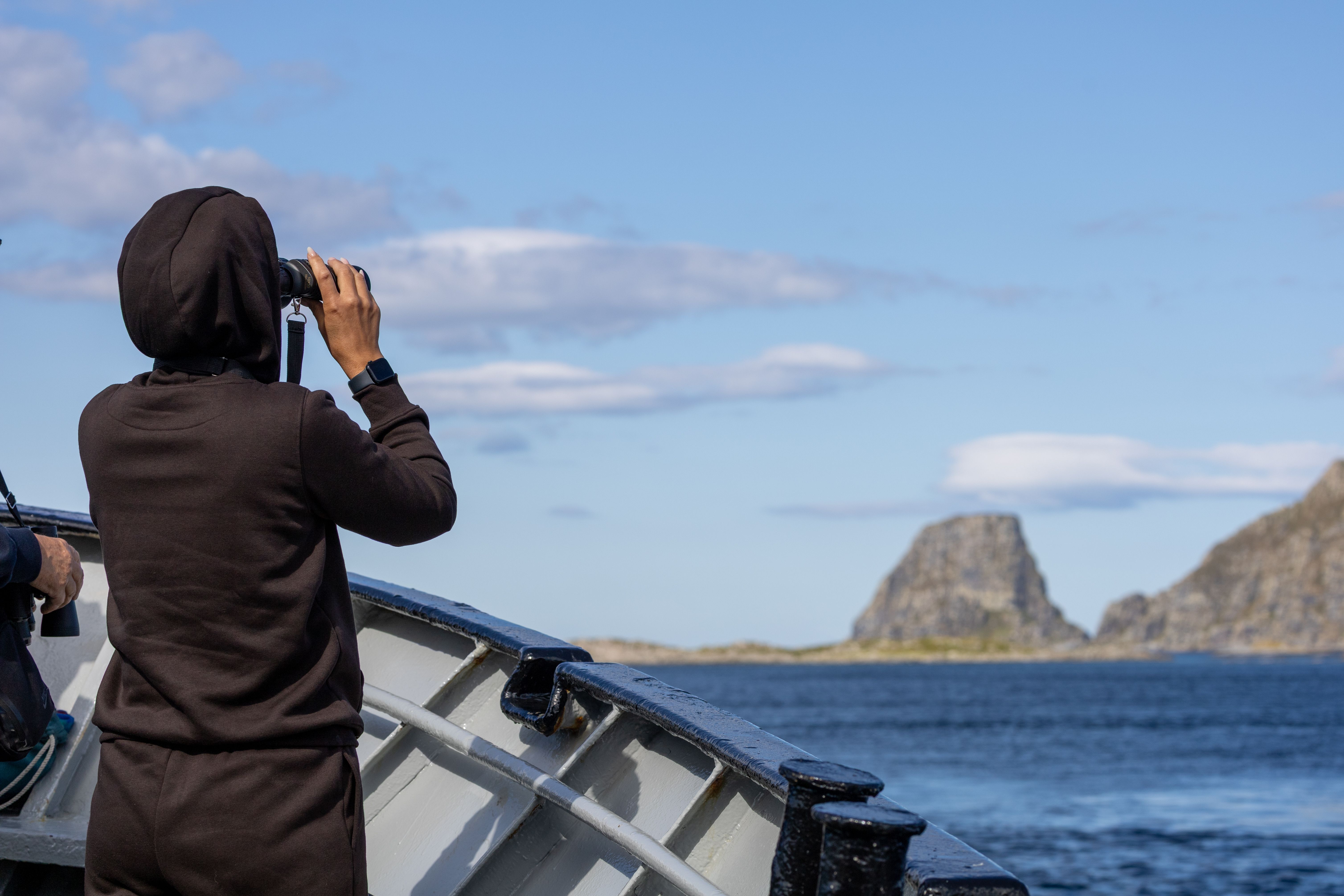 Guest looking in binoculars