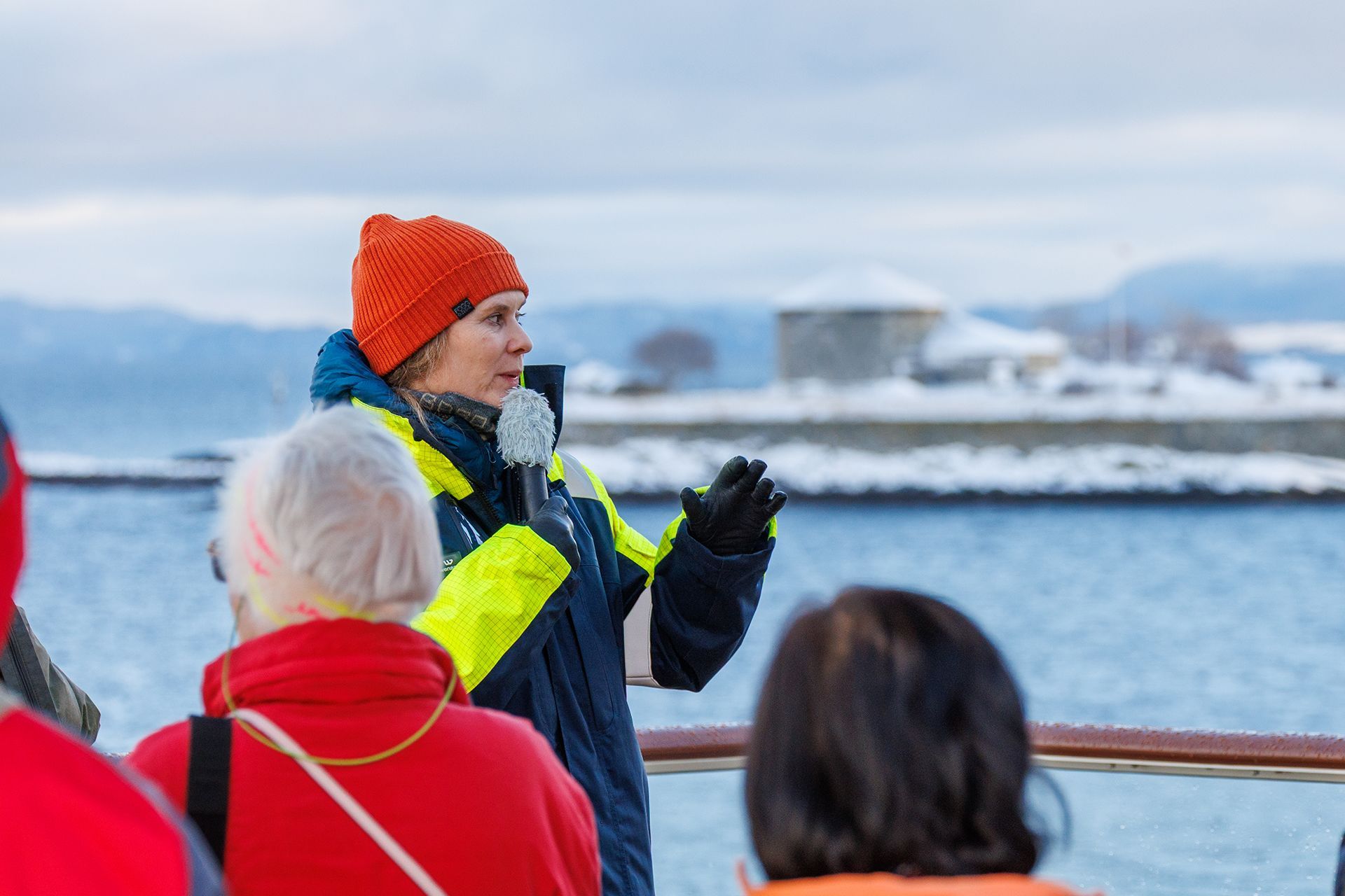 The crew shares the history of Munkholmen as the ship sails past the island outside Trondheim.