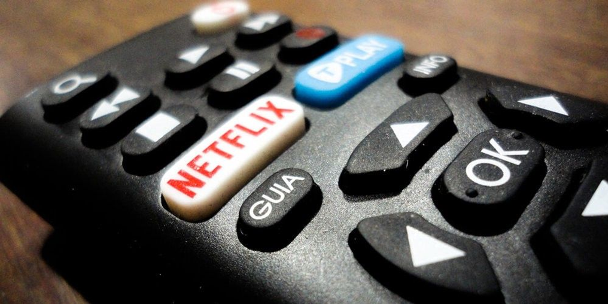 A remote showing a prominent Netflix button