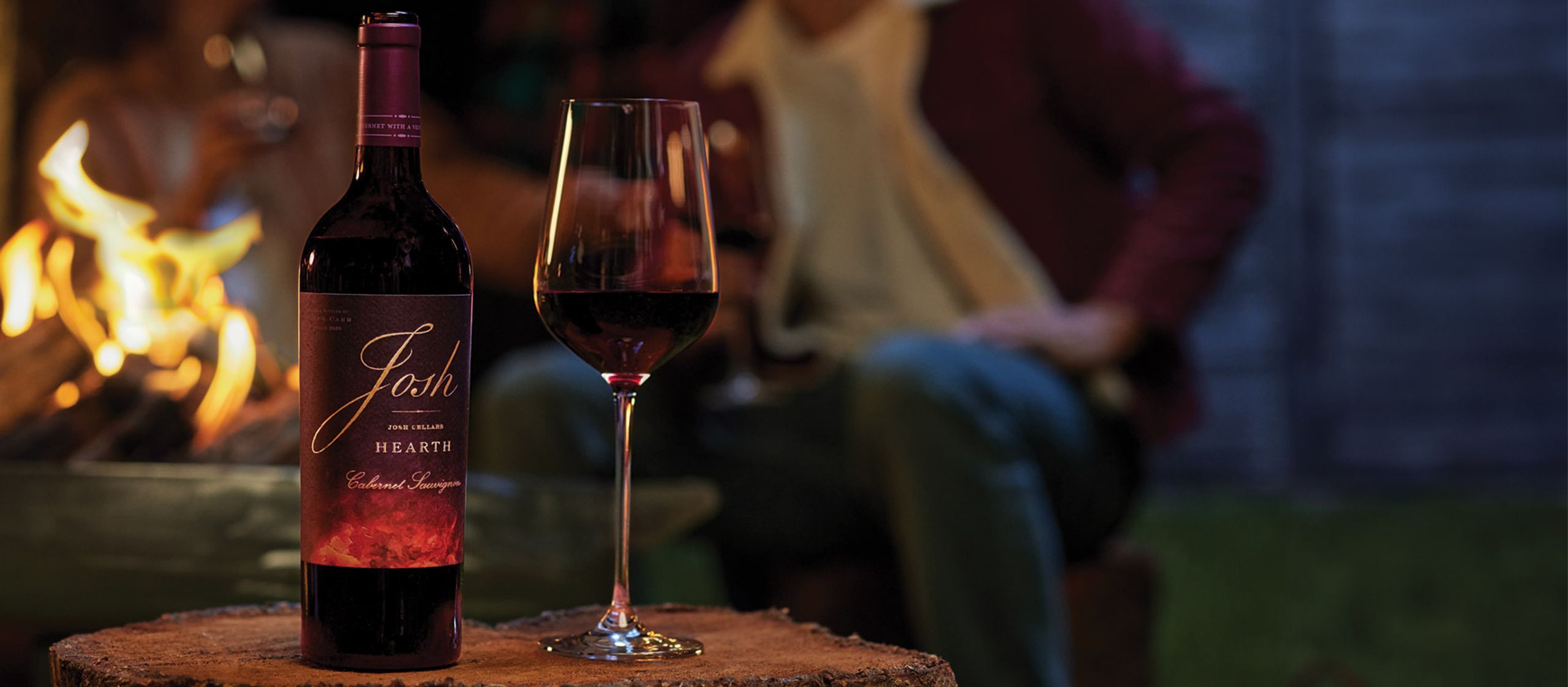 Josh Hearth wine bottle & glass fireside