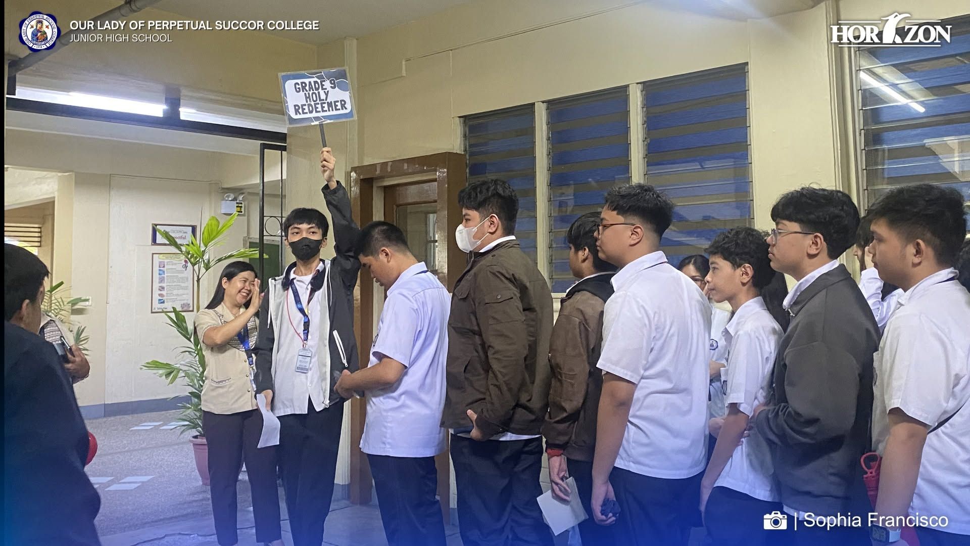 Mrs. Herrera guides Grade 9 Holy Redeemer students to their classroom on the opening day of School Year 2026–2027 at OLOPSC.