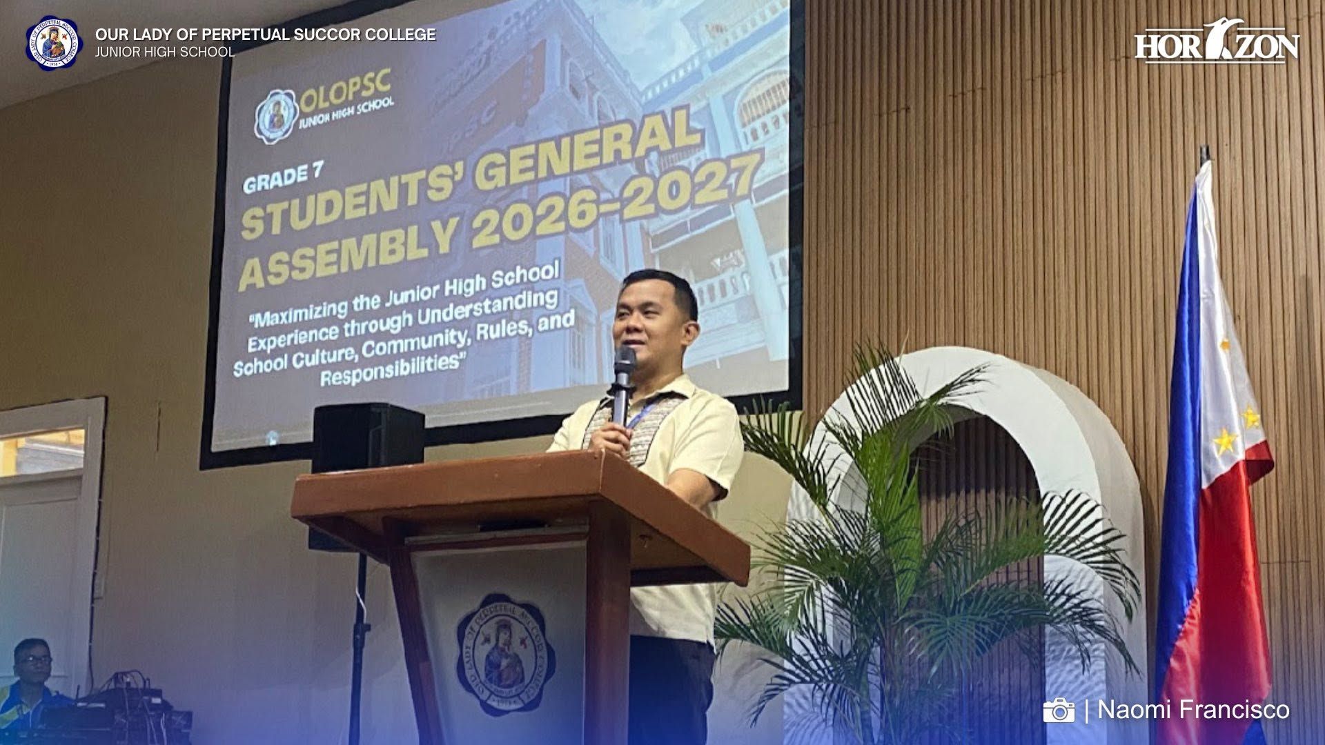 JHS Assistant Principal for Administration Mr. Richard C. Jardeliza delivers the opening remarks and reminders during the OLOPSC Junior High School Students' General Assembly 2026–2027.