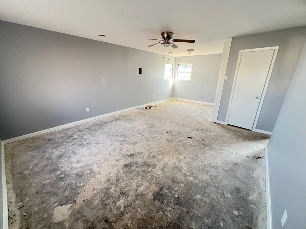 Room with no floor needing repairs