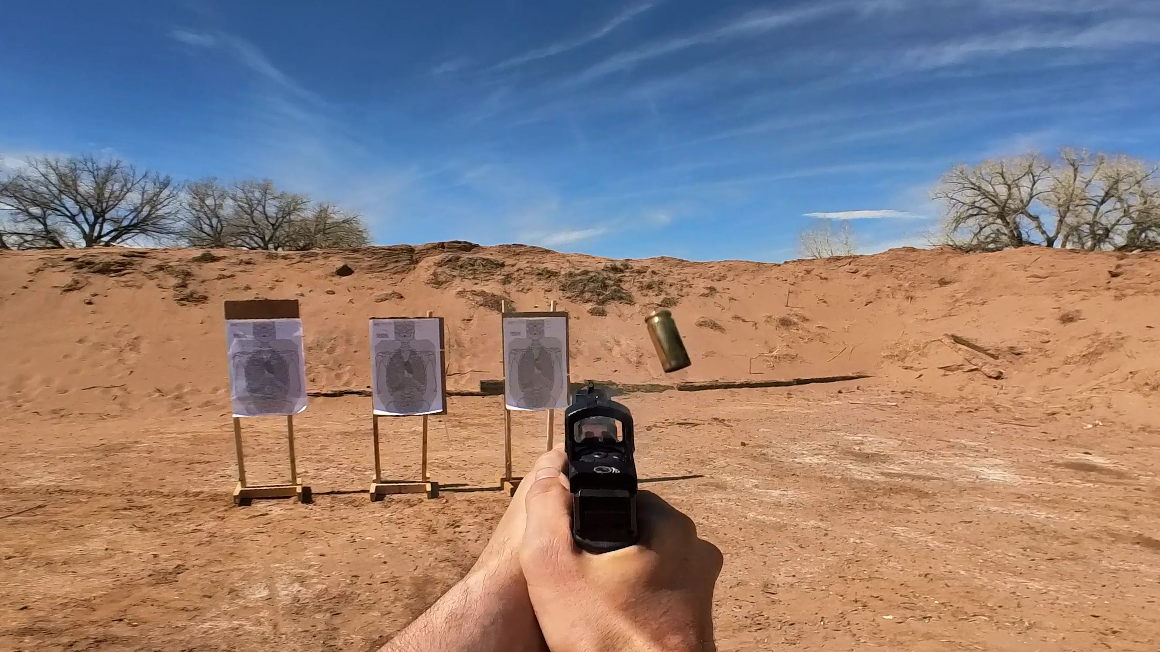 El Presidente drill start position, shooter back to three targets at 10 yards