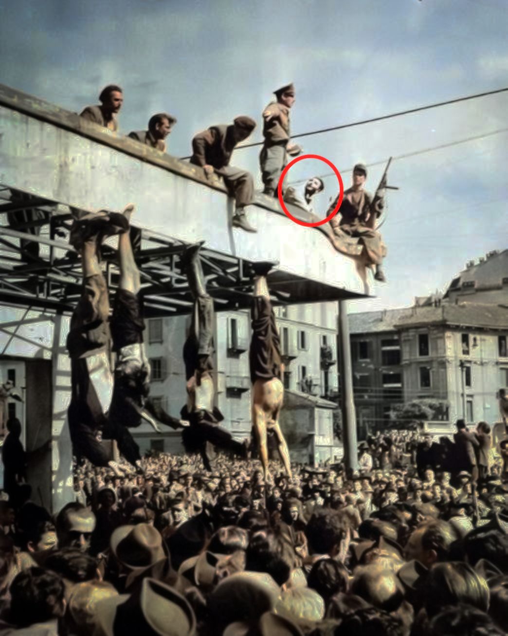 The public hanging of Mussolini at Piazzale Loreto, Milan, Sal can be seen in the background
