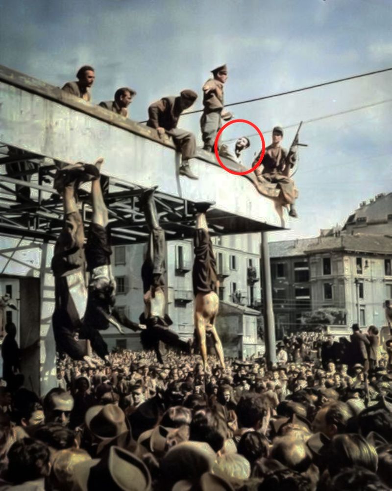 The public hanging of Mussolini at Piazzale Loreto, Milan, Sal can be seen in the background