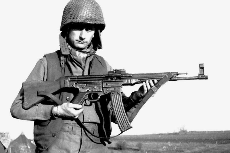 Young boy holding an StG 44, the weapon that changed infantry combat forever, now a piece of living history