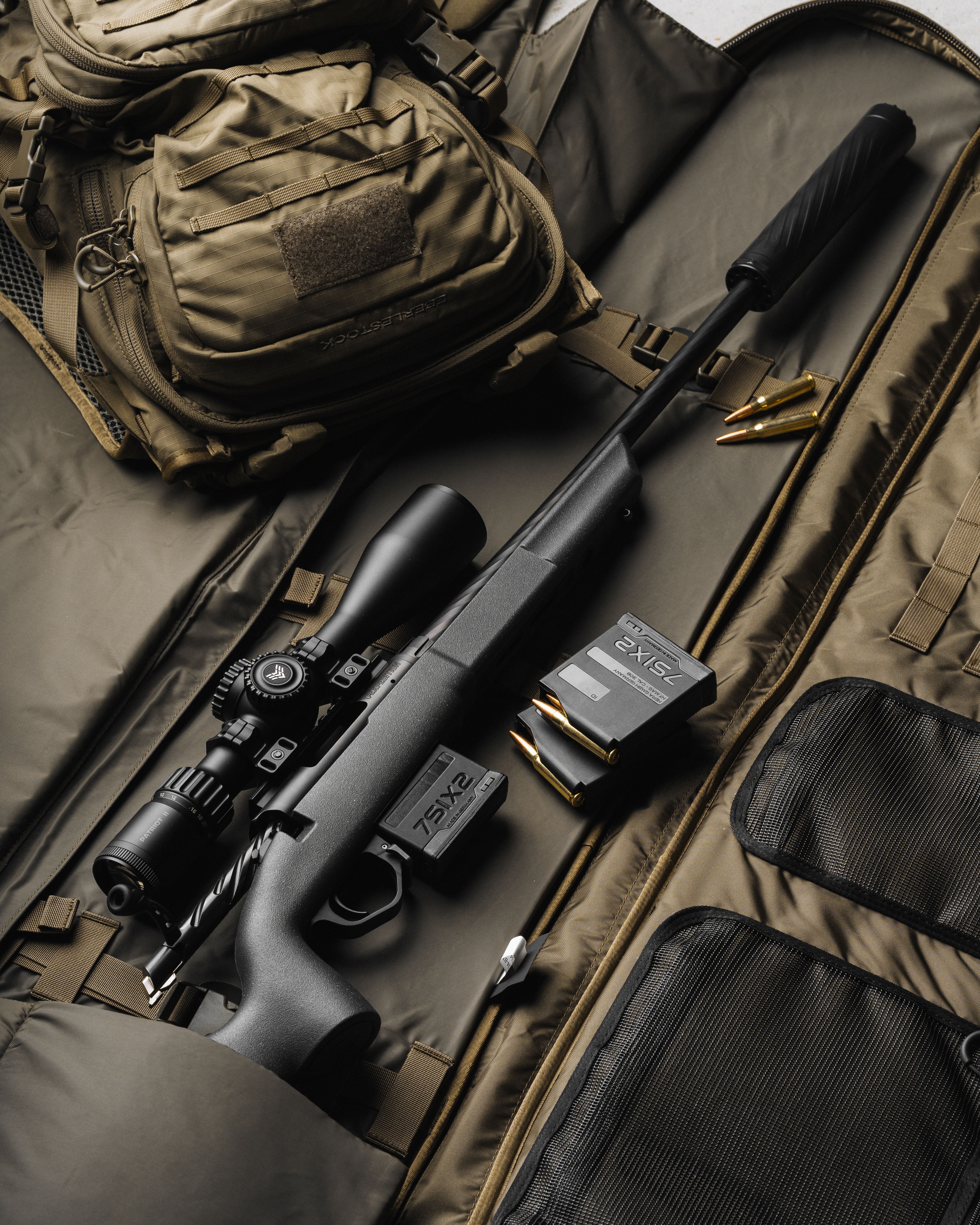 Patriot II mounted on a rifle laying in a range bag