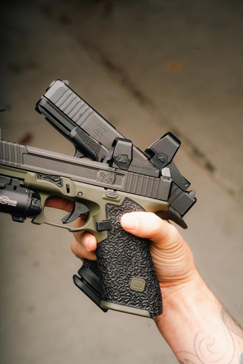 Two Glocks side by side, one with a Liberty II, one with a Justice II