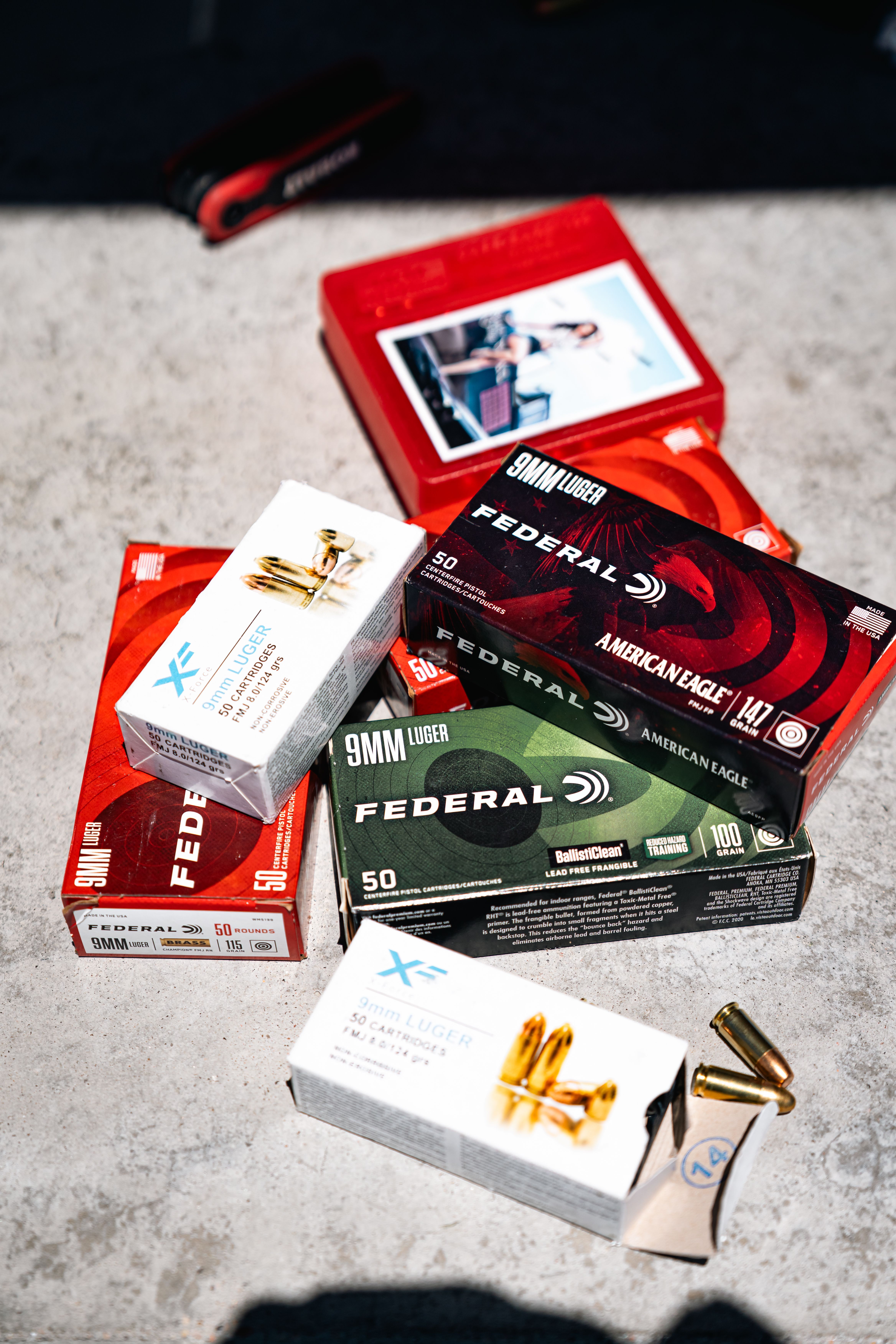 A range of 9mm factory ammunition boxes in various grain weights