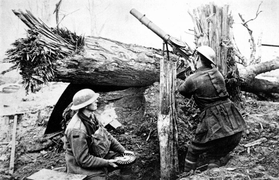 Lewis gun — gas-operated, pan-fed, twenty-eight pounds, and the first reliable light machine gun that could keep up with an infantry advance