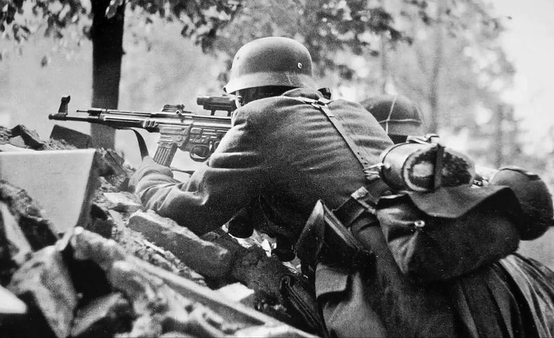 German soldier using an StG 44 in combat, demonstrating the weapon's select-fire capability and 300-meter effective range
