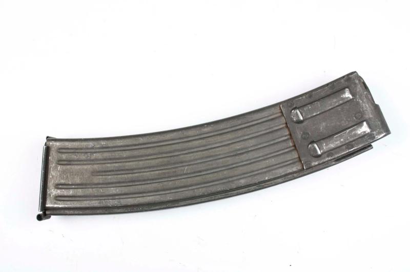 StG 44 magazine, the curved 30-round detachable magazine design that established the template both the AK-47 and M16 would follow